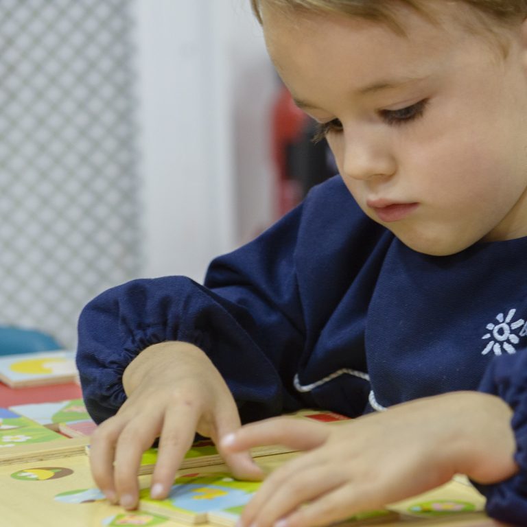 boy doing a jigsaw