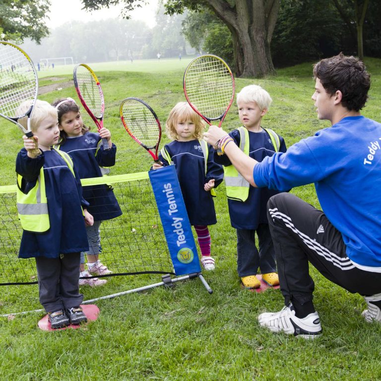 pupils holding tennis rackets