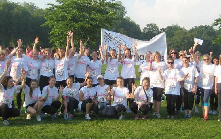 staff cheering in a big field