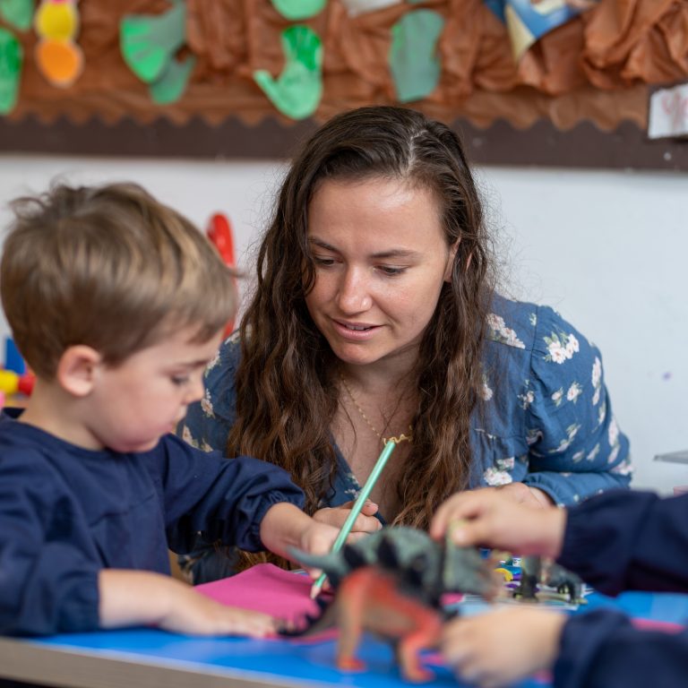 teacher and child colouring