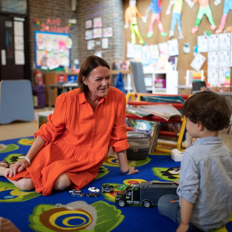 Boy playing with his teacher