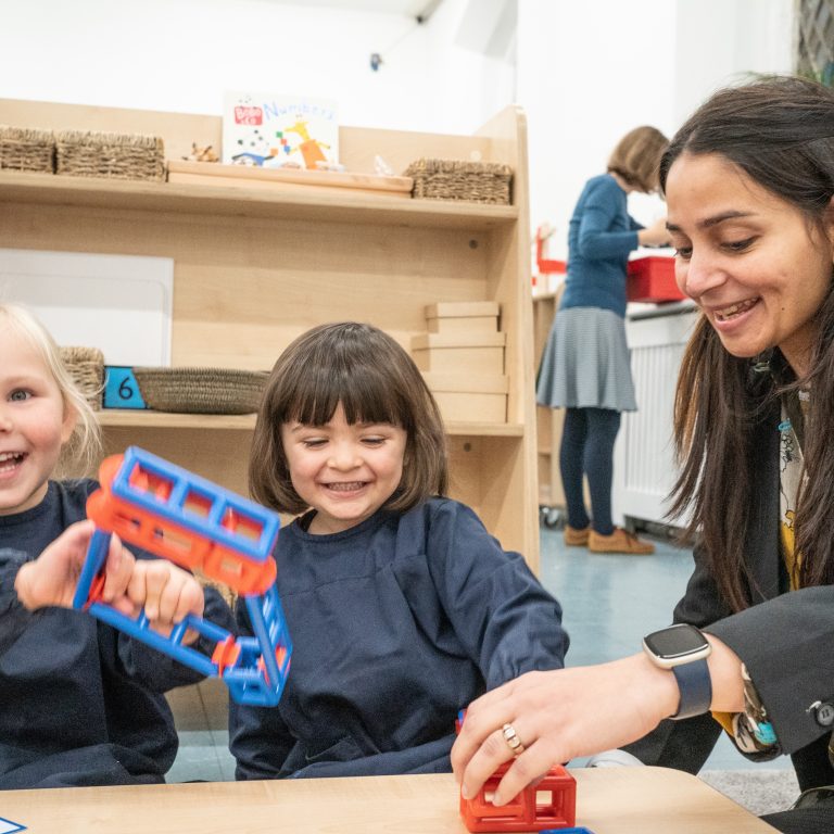 Students playing with their teacher