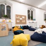 bean bags across the room with different animal plushies on them