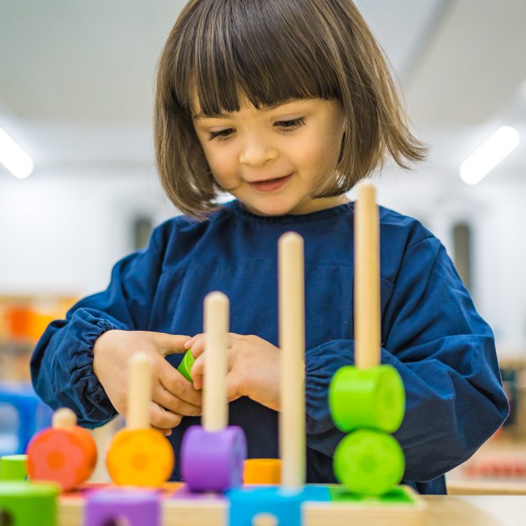 Little girl playing with blocks