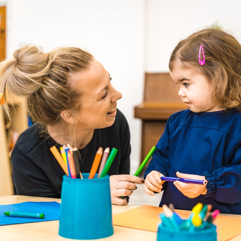 a child and a teacher talking