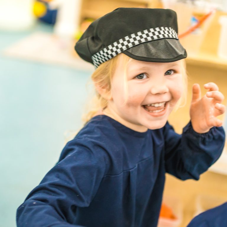 child with a police hat on
