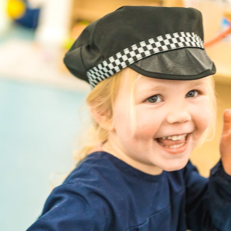 Girl wearing a police hat